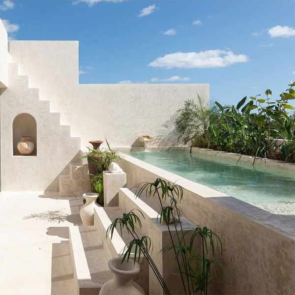 above ground white pool by Terreo Studio