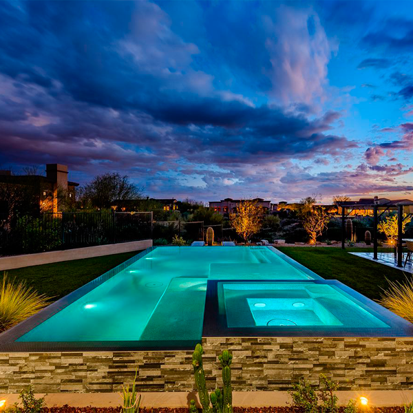 infinity pool and spa at sunset by Botanist of the Valley