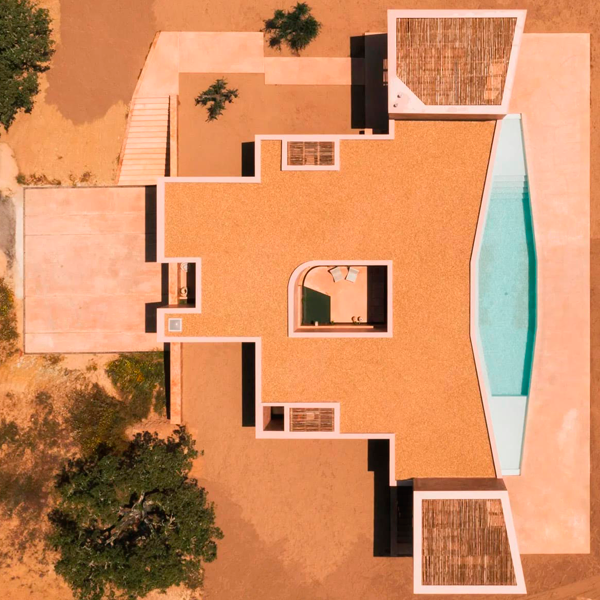 custom pool in a modern house drone view by Bak Gordon