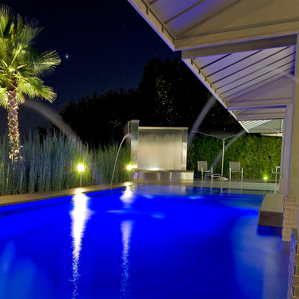 private overflow swimming pool at night