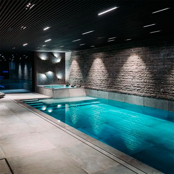 indoor overflow pool with spa, by Mari