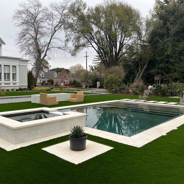 private pool and spa, by Chambers Pools, a cloudy day in a large garden