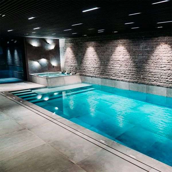 indoor overflow pool with spa, by Mari