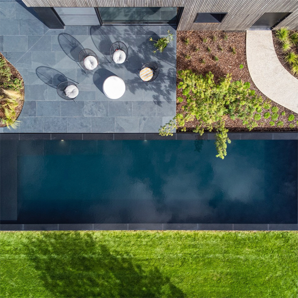 drone view of a black pool in a modern garden, by Art Pools