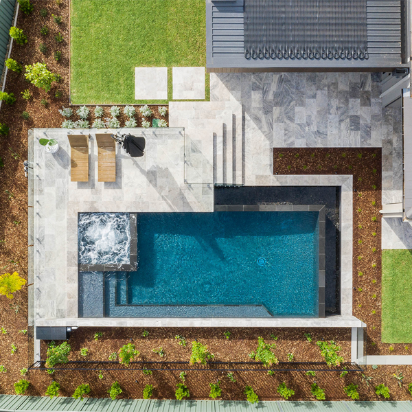 infinity pool with spa drone view by simon rosa landscaping