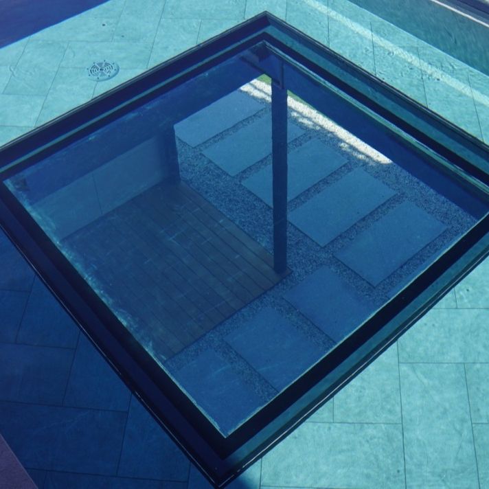 Squared shaped underwater window by Holland Aqua Sight, at the bottom of a pool