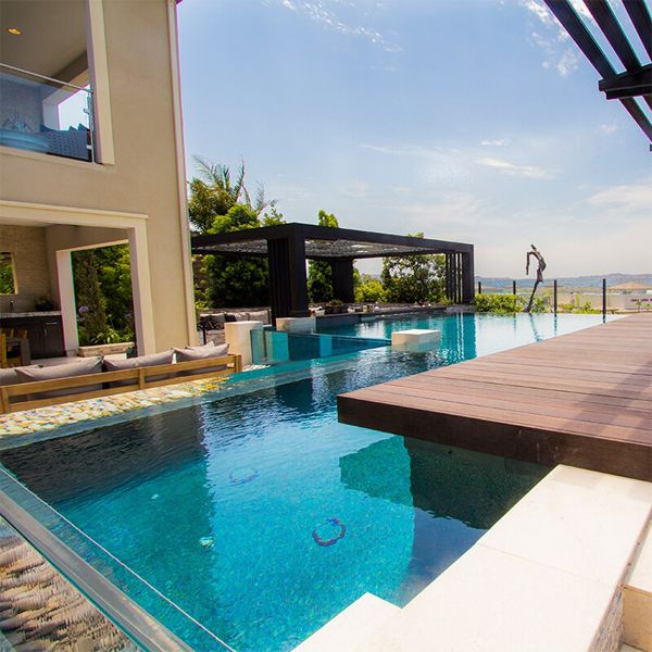 transparent infinity pool by Splash Pools and Construction