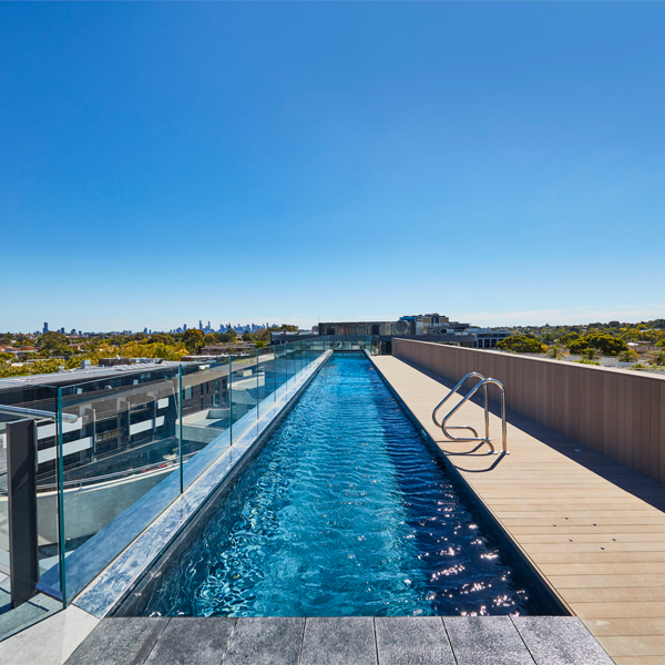suspended lap pool betweeen two blocks of buildings by Aloha Pools