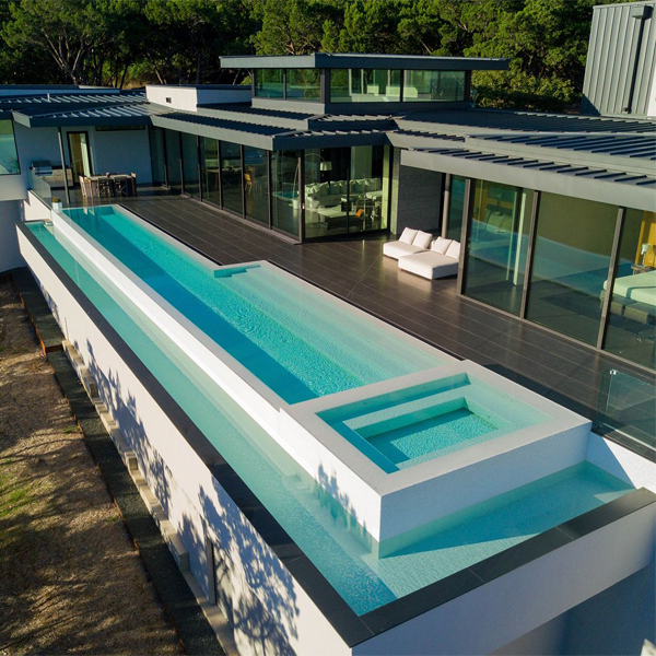 white infinity pool with spa by Design Aquatics