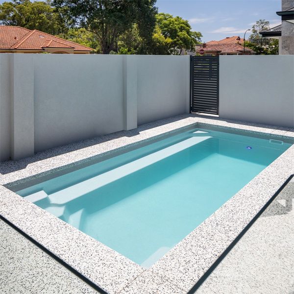 prefab mini pool with an alabaster colour ina private backyard, by Freedom Pools Australia