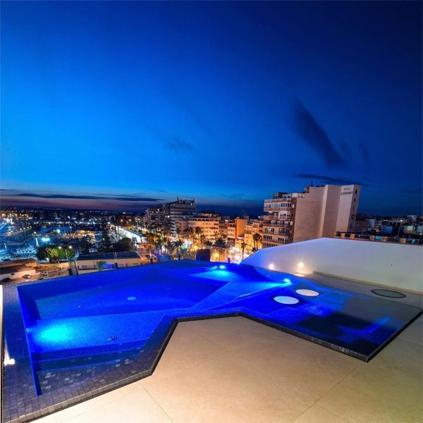 mini infinity pool spa, at sunset, by Gunitec Pools