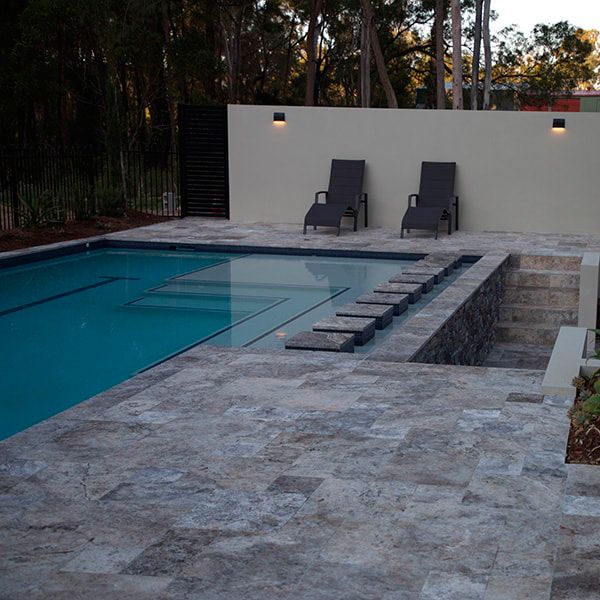 custom lap pool at sunset, by Cityscapes Pools and Landscapes