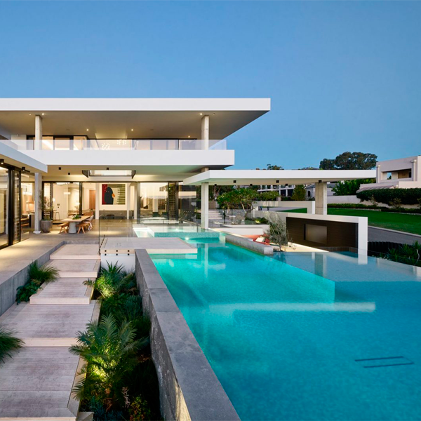 custom infinity pool and spa by Blue Stone Pools in a modern project by Averna Homes
