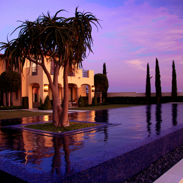 infinity pool at sunset by ams landscape design