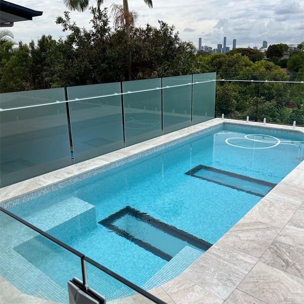 private custom pool with underwater windows in the floor, by Dreamscape Pools and Landscaping