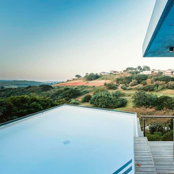 unique suspended pool at sunset, in a project by Map Architects in South Africa