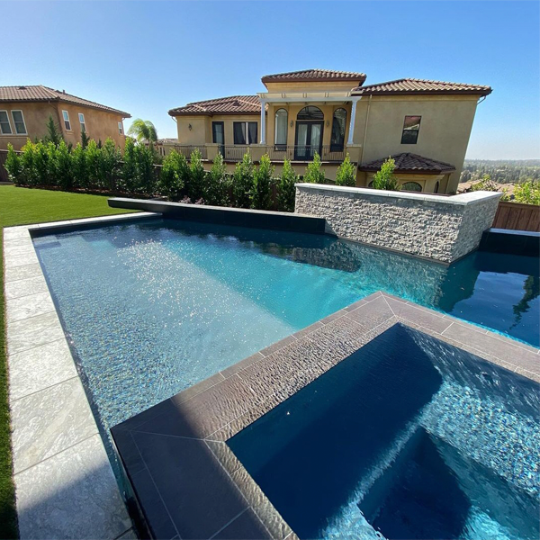 private geometric pool with raised spa by Progressive Landscapes