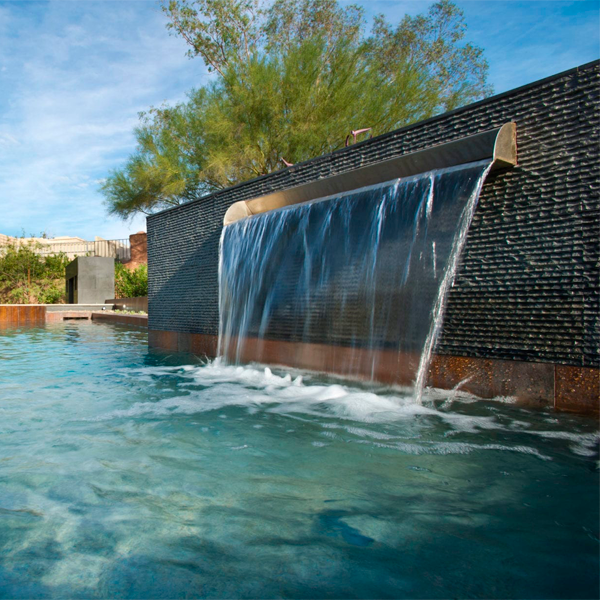 waterfall in a pool in the middle of the desert