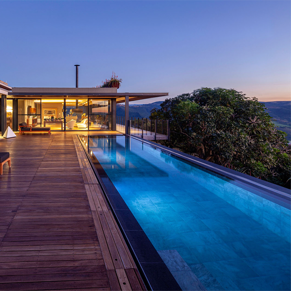lap infinity pool at night by Elphick Proome Architecture
