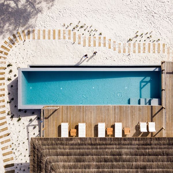 drone view of infinity pool in a project by Pereira Miguel Arquitectos