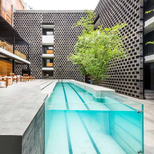 lap pool with pool window in Carlota Hotel by JSA