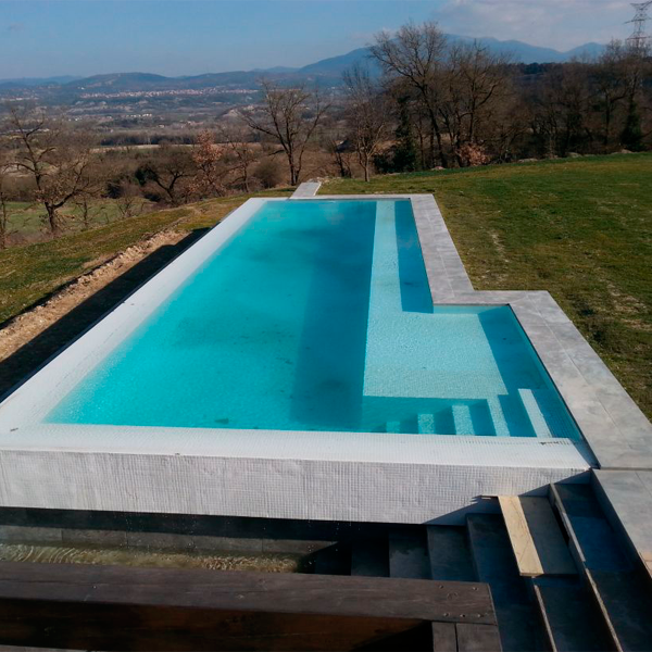 white infinity pool in the middle of the mountains
