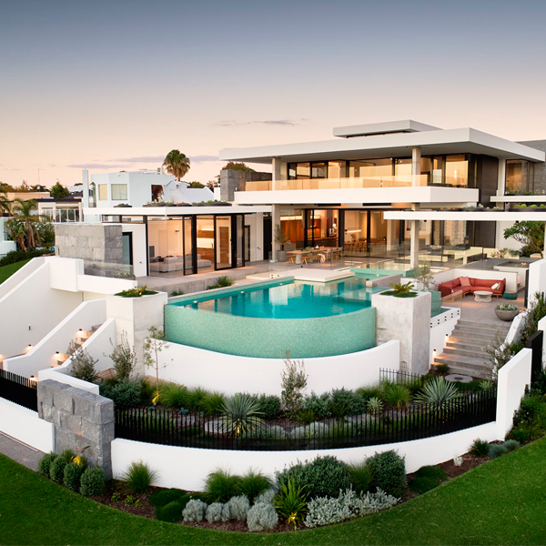 custom infinity pool and spa by Blue Stone Pools in a modern project by Averna Homes