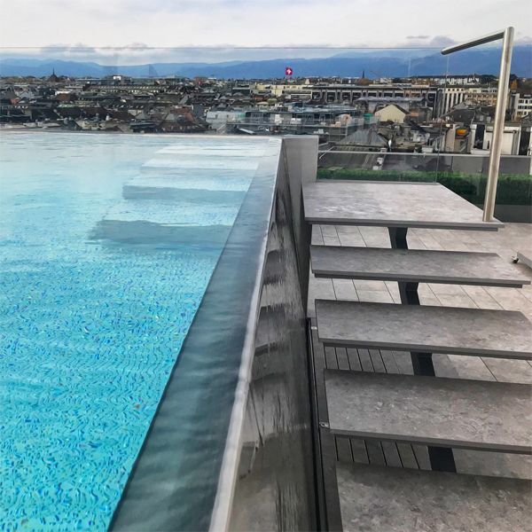 infinity stainless steel swimming pool, with external access steps, built on a rooftop, by Wonderwerk