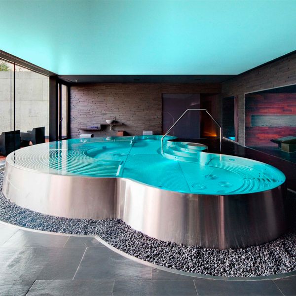 Custom indoor stainless steel infinity pool-spa, by Berndorf Baederbau, inside Miura hotel