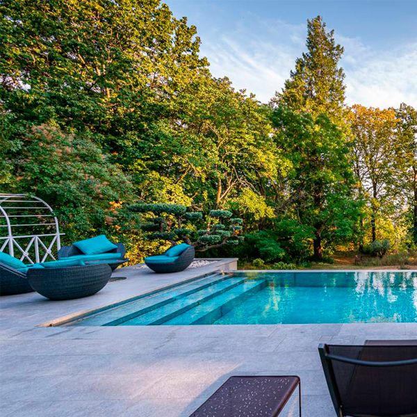 stylish infinity pool with mobile floor, by Côté Jardin