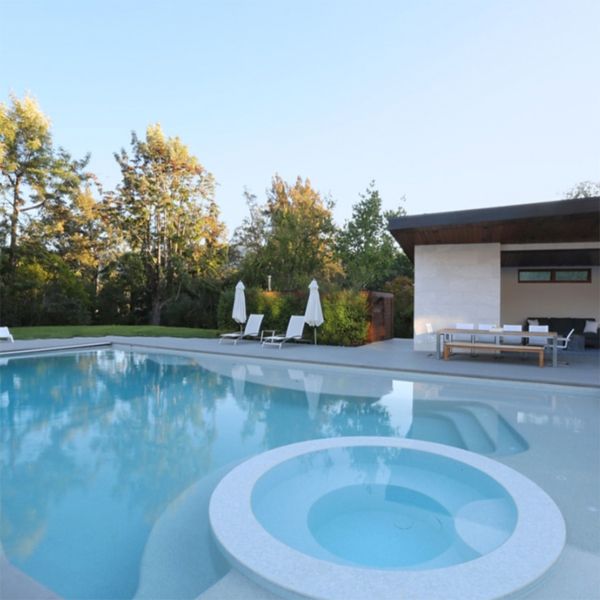 modern white pool with spa, in a project by Greenblott Design