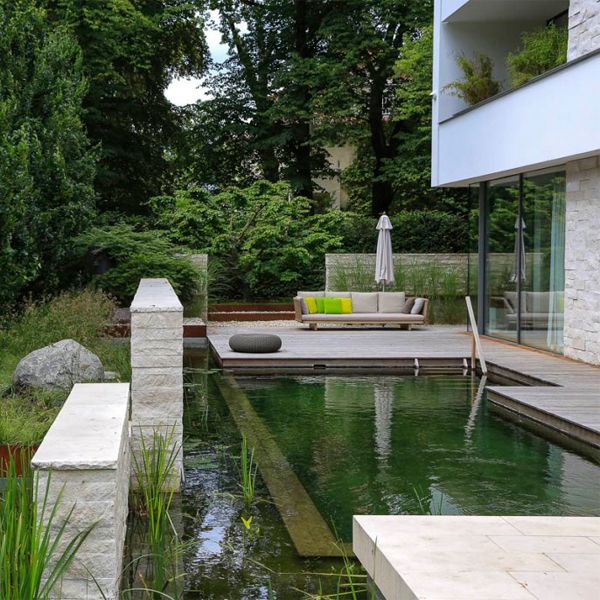 modern design natural pool by Postdamer Gaerten