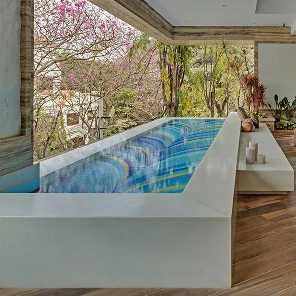 white structure infinity pool by ZZ Architects with custom pool ceramics by Craig Bragdy Designswith
