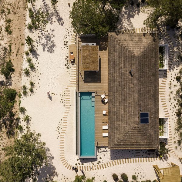 drone view of an infinity pool in a project by Pereira Miguel Arquitectos