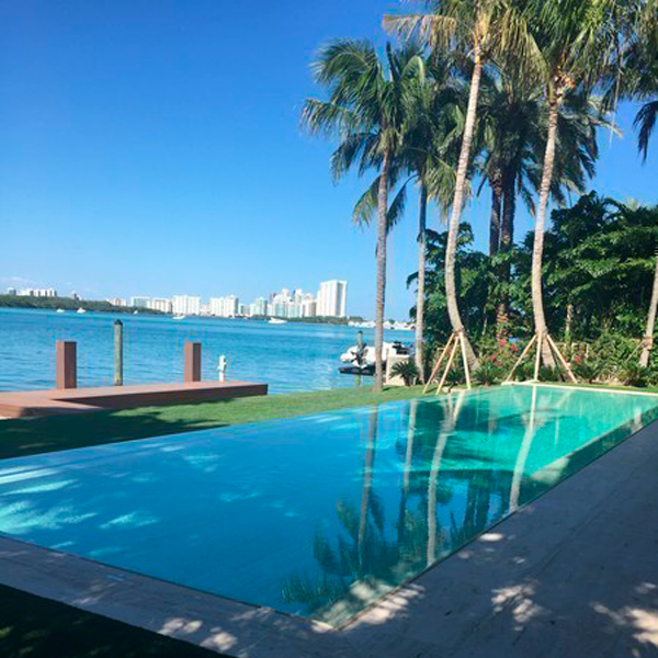 transparent infinity lap pool by Regency Pool and Spa