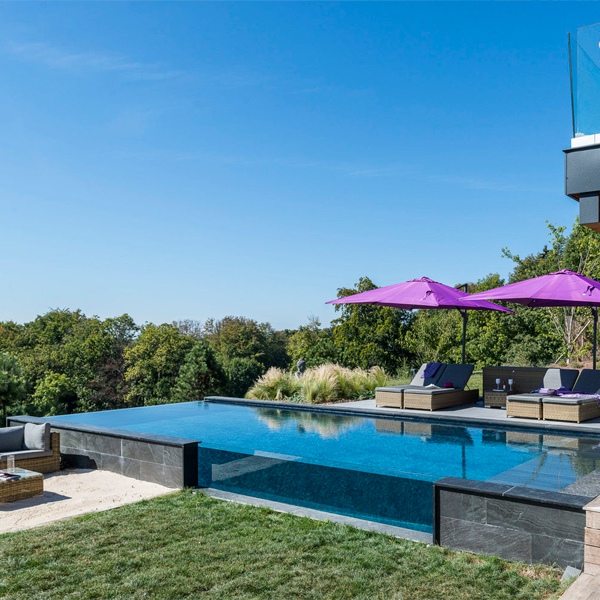 infinity pool with transparent window by Atelier Olea