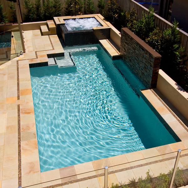white swimming pool and black spa