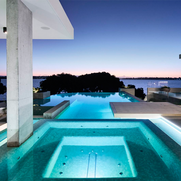 custom infinity pool and spa by Blue Stone Pools in a modern project by Averna Homes