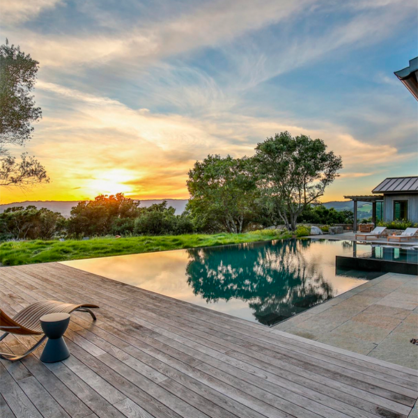 infinity pool and spa at sunset, by Roche and Roche Landscape Architecture