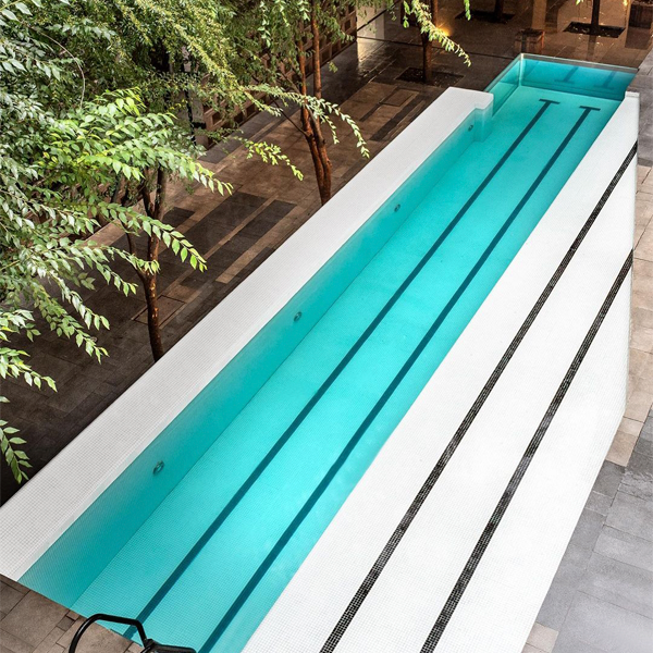 lap pool with pool window in Carlota Hotel by JSA