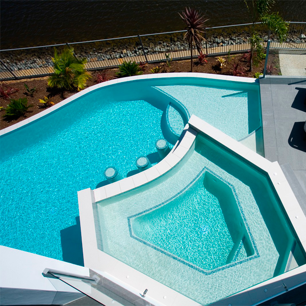 custom infinity pool with raised spa by Brisbane Pools and Landscapes