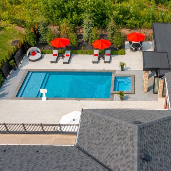 drone view of a classic rectangular pool design and spa, by Aqua Spa Pools