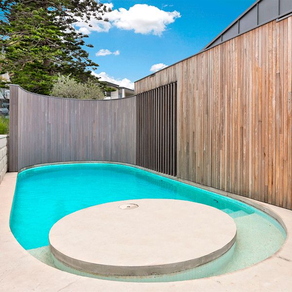rounded shaped custom pool by Focus Pools