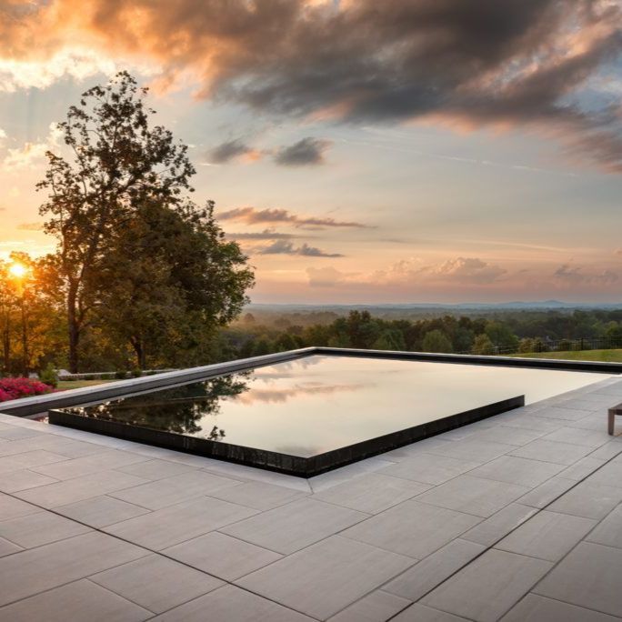 Geometric polol with built-in spa, at sunset, by Basin Pool Designs