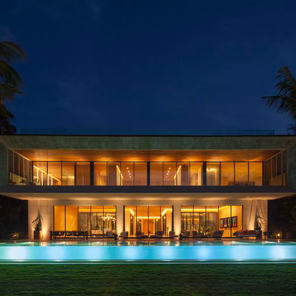 infinity transparent pool at night by Oppenheim Architecture