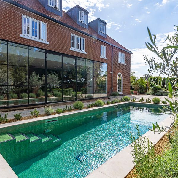 bright tile private pool by Aquaria Pools