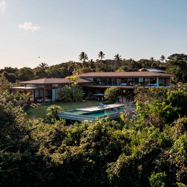 drone view of an infinity pool with hijau-sukabumi stone coating, in a project by ARC+CO