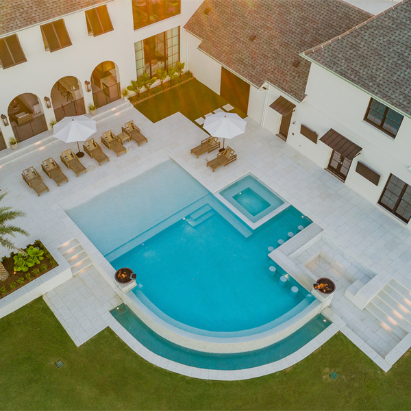 drone view of a custom infinity pool with spa by GW Oliver