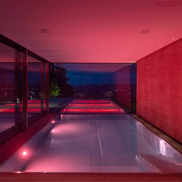 Lighted overflow steel pool by Bergmann Schwimmbad