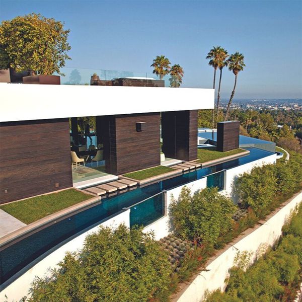 drone view of an incredible pool project around the whole house, by Whipple Russell Architects